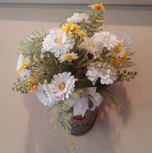 Daisies and ferns in a hanging tin